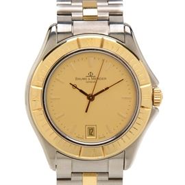 Baume & Mercier Date 34.00 mm 18K Gold & Steel Quartz Wristwatch: A Baume & Mercier Date 34.00 mm Swiss made luxury two tone 18K yellow gold and stainless steel quartz wristwatch. The watch does not come with a box or papers.