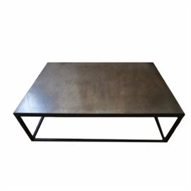 Rectangular Metal Coffee Table: A rectangular metal coffee table. This coffee table features an inset top with a hexagonal pattern over a metal base. The metal base features straight legs and a low box stretcher.