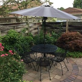 Russell Woodard Sculptura patio....table and umbrella with 4 chairs plus 4 more chairs