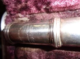 CLOSE UP VIEW OF SIGNED NICKLE PLATED FLUTE