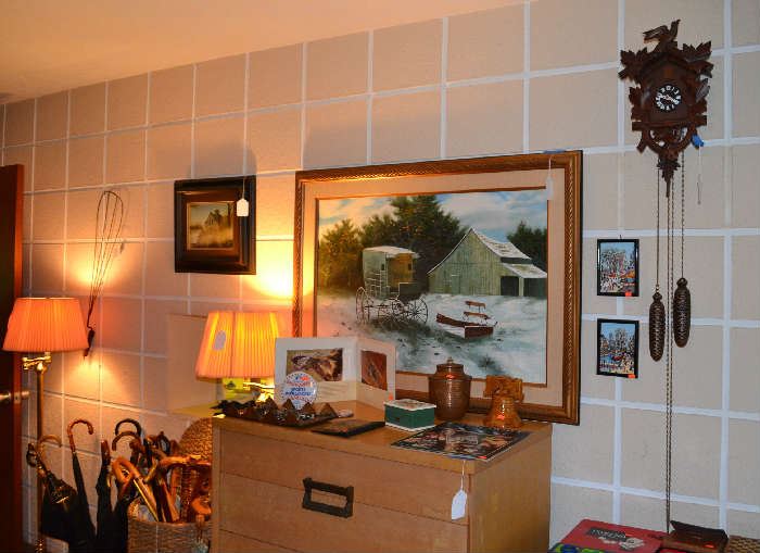 ART AND CLOCKS IN FAMILY ROOM