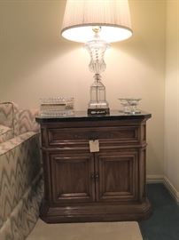 Matching pair of black marble top side tables. Matching pair of crystal lamps
