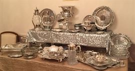 Silver plated champagne bucket, serving trays including electric warming tray, waiters trays, carafes, serving dishes, Paul Revere bowls (large and small with liners), tray full of silver plated serving pieces