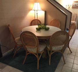 Yet another round table with 6 chairs.  Bamboo with caned back and one leaf.  Round and oval options