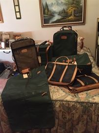 Lots of Jon Hart luggage.  Two suitcases, one BRAND with its own protective cover - not monogrammed.  Joh Hart totes, new garmet bag, cooler tote, purses, and totes