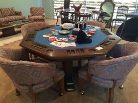 3-in1 game table - Poker, bumper pool, and flips to a dining table.  Four barrel chairs with brass coasters