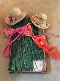 Pair of vintage grass skirts, tops, leis, and hats from Hawaii - never worn
