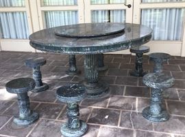 Solid marble patio set. 8 marble stools.  Lazy Susan. Purchased abroad and shipped to US. 