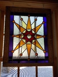 One of many antique stained glass windows