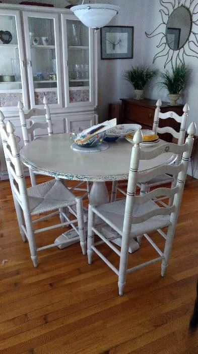 This table and chairs set is certainly one of a kind!!  It's been hand painted with lots of detail.