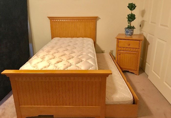 Maple Trundle Bed w/ 1 pillow-top mattress, 1 regular mattress, and a matching nightstand