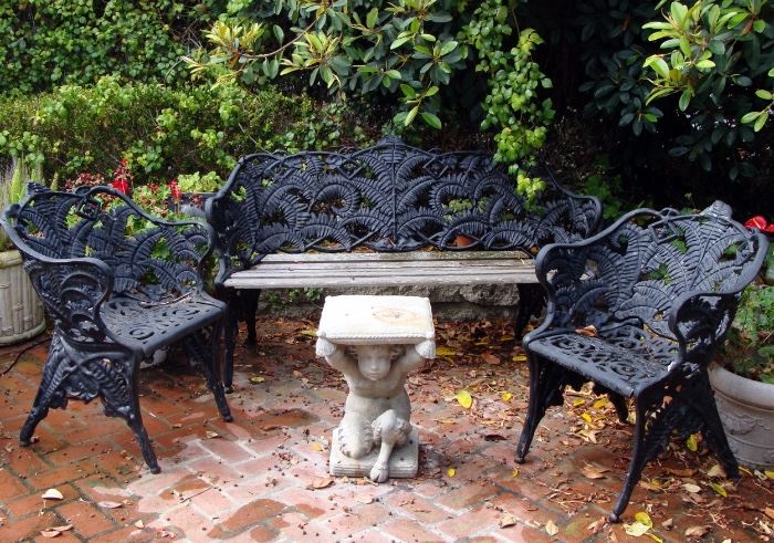 19th century cast iron Coalbrookdale garden seating group with figural stone Pan garden table