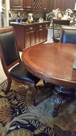 Beautiful round table and 4 chairs.  Owner paid $600.00 for each of these leather chairs.  Sooo nice.