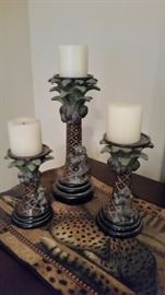 Three candle holders and a runner.  There are two other runners that match this one on the night stands