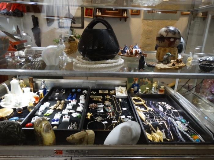 There's some costume jewelry - also come Native American and Alaskan Bear figures and pottery - interesting smalls