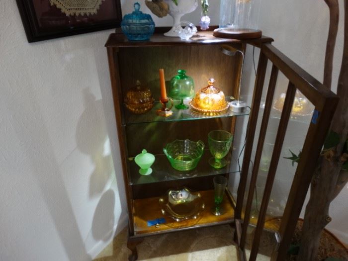 a snakk dusplay cabinet w/ depression glass