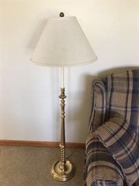 A beautiful brass standing lamp.