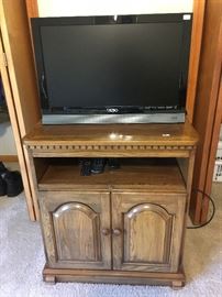 This is a TV stand with another smaller Vizio TV.