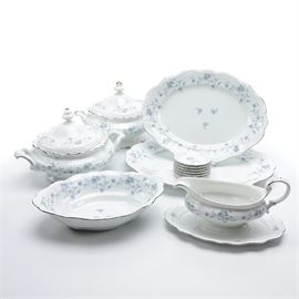 Johann Haviland German "Blue Garland" Tableware: A group of china tableware by Johann Haviland in the Blue Garland pattern. Made in Germany, this group includes two covered serving dishes, an oval serving bowl, a gravy boat and saucer, two oval platters, and six small round dishes. Each of the pieces is marked “Johann Haviland Bavaria Germany” to the underside.