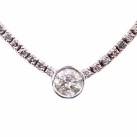 14K White Gold 8.20 CTW Diamond Necklace: A 14K white gold necklace featuring a length of 166 diamond side stones leading to a bezel set 1.56 ct diamond center stone. The necklace contains a total diamond weight of 8.20 ctw.