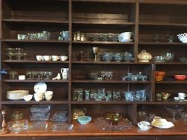 Tea cups, glass serving pieces, plates and cups