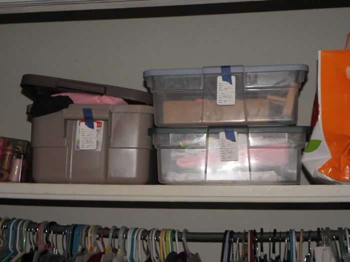 Boxes of material, boxes of sewing notions, cross stitch items.