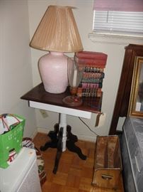 Set of pink base lamps, hardback books, brass magazine holder