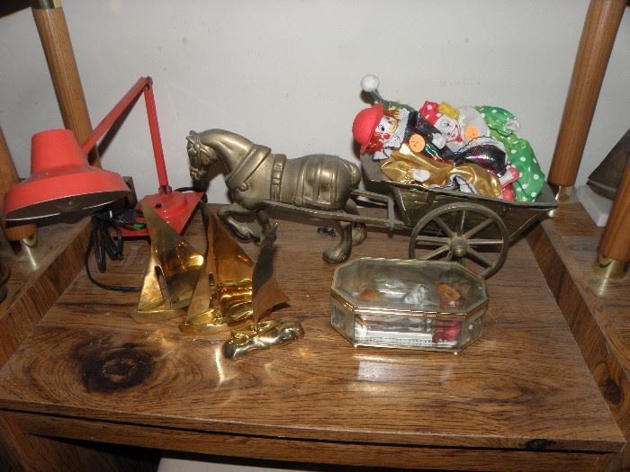 Brass items and some more clowns.  Folding light. Brass and glass display case.