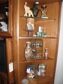 Brass and glass small displays complete with the items inside, alabaster items, 