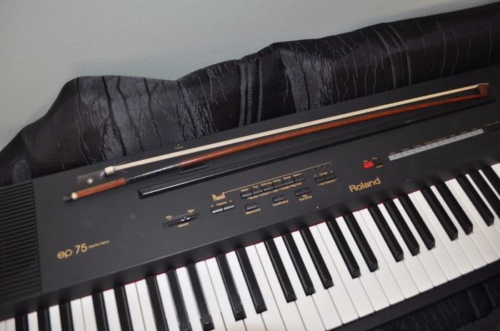 Roland EP 75 digital piano keyboard in case, excellent condition, violin bow