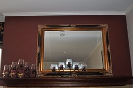 Assorted black metal candleholders with glass globes, beveled rectangular mirror in black and gold ornate frame (SOME SOLD)