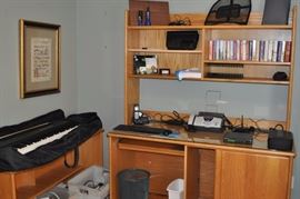 Framed prints, Roland EP 75 digital piano keyboard with case, oak counter/credenza with wheels, oak computer desk with pullout for keyboard, various office items, paperback novels