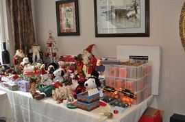 Assorted Christmas and Halloween decorations, 3 cases of Halloween mugs, several framed pieces of art
