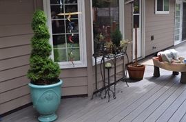 Large planted Molbak's pot, assorted iron planters, tall candle holders, Little Tykes water table pirate ship from grandkids (SOME SOLD)