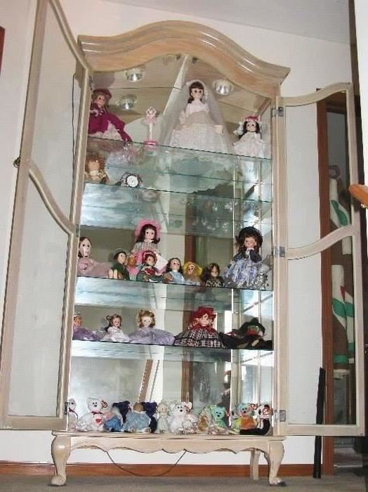 curio filled with MORE dolls