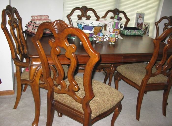 Dining room table with chairs and leaves