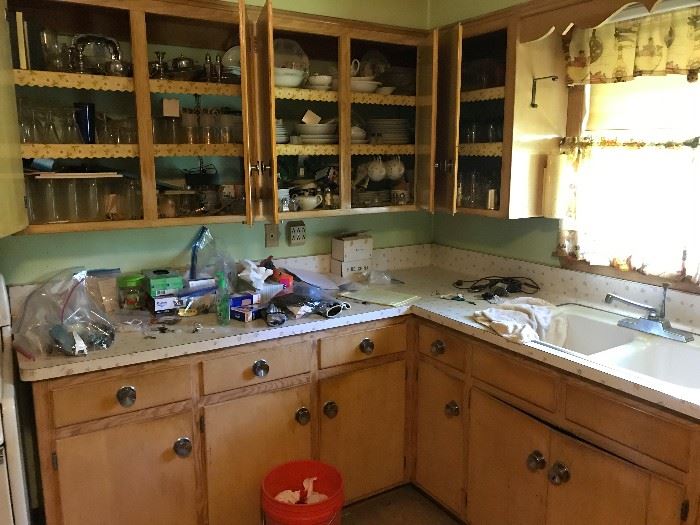 Kitchen filled with gassware and utensils, cookware