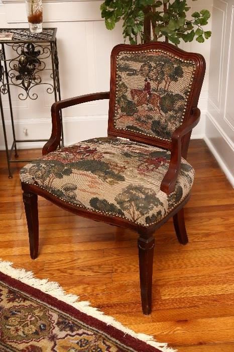 Armchair with hunt scene upholstery.