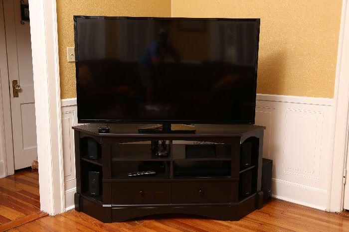 60 inch Vizio Smart TV television on TV cabinet.