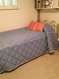 One of two twin beds
