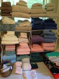 Many towels, sheets, and other linens