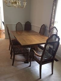 Solid wood dining room table with additional leaf. Total of 8 chairs. Being sold as a set.