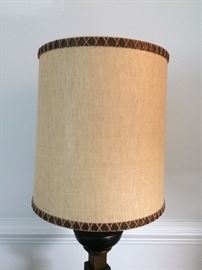 Large barrel style lamp shades. Lamps are both metal and wood in design.