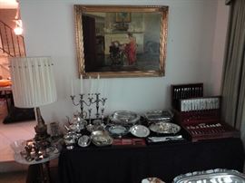 Oil painting, brass cherub marble table lamp, William Rogers first love flatware set, Community flatware 12 place setting, silver plated candelabra, silver plated coffee set, many silver plated platters and serving bowls and sterling silver candlesticks