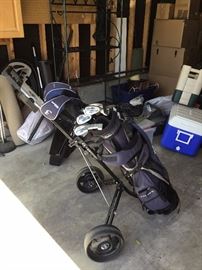 Golf clubs and rolling bag
