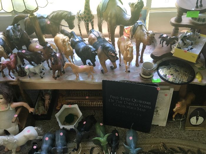 collection of horses, pink marble top coffee table
