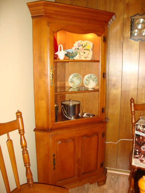 One of two matching corner cabinets