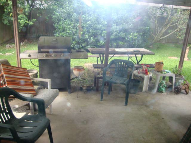 Back patio - nice cast iron pot in holder, picnic bench, misc....