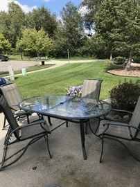 OUTDOOR PATIO FURNITURE-METAL TABLE WITH GLASS TOP AND CHAIRS
