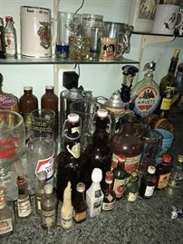 TONS OF COLLECTIBLE JIM BEAM AND LIQUOR BOTTLES